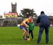 28 January 2018; Sean Brew, age 8, from Ennis, has his photograph taken with Clare's David McInerney, by his father John, following the Allianz Hurling League Division 1A Round 1 match between Clare and Tipperary at Cusack Park in Ennis, County Clare.  Photo by Stephen McCarthy/Sportsfile