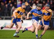 28 January 2018; Dan McCormack of Tipperary in action against David Fitzgerald, left, and David McInerney of Clare during the Allianz Hurling League Division 1A Round 1 match between Clare and Tipperary at Cusack Park in Ennis, County Clare.  Photo by Stephen McCarthy/Sportsfile