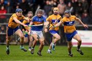 28 January 2018; Alan Flynn of Tipperary in action against Clare players, from left, David Fitzgerald, Gearoid O'Connell and David McInerney during the Allianz Hurling League Division 1A Round 1 match between Clare and Tipperary at Cusack Park in Ennis, County Clare.  Photo by Stephen McCarthy/Sportsfile