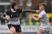 31 January 2018; Larry Kelly of Newbridge College holds off the tackle of Ben Murphy of Presentation College Bray during the Bank of Ireland Leinster Schools Senior Cup Round 1 match between Newbridge College and Presentation College Bray at Donnybrook Stadium in Dublin. Photo by Seb Daly/Sportsfile