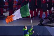 9 February 2018; Flagbearer Seamus O'Connor of Ireland leads his team during the parade of nations at the opening ceremony of the Winter Olympics at the PyeongChang Olympic Stadium in Pyeongchang-gun, South Korea. Photo by Ramsey Cardy/Sportsfile Photo by Ramsey Cardy/Sportsfile