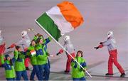 9 February 2018; Flagbearer Seamus O'Connor of Ireland leads his team during the parade of nations at the opening ceremony of the Winter Olympics at the PyeongChang Olympic Stadium in Pyeongchang-gun, South Korea. Photo by Ramsey Cardy/Sportsfile Photo by Ramsey Cardy/Sportsfile