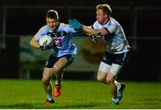 14 February 2018; Conor McCarthy of University College Dublin in action against Frank Burns of Ulster University during the Electric Ireland HE GAA Sigerson Cup Semi-Final match between Ulster University and University College Dublin at Grattan Park in Inniskeen, Monaghan. Photo by Oliver McVeigh/Sportsfile