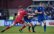 17 February 2018; Ross Byrne of Leinster is tackled by Steve Cummins of Scarlets during the Guinness PRO14 Round 15 match between Leinster and Scarlets at the RDS Arena in Dublin. Photo by Brendan Moran/Sportsfile