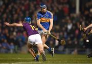 17 February 2018; Jason Forde of Tipperary shoots to score his side's second goal despite the attention of Conor Firman of Wexford during the Allianz Hurling League Division 1A Round 3 match between Tipperary and Wexford at Semple Stadium in Thurles, Tipperary. Photo by Stephen McCarthy/Sportsfile