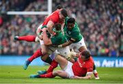 24 February 2018; CJ Stander of Ireland is tackled by Hadleigh Parkes and Scott Williams of Wales during the NatWest Six Nations Rugby Championship match between Ireland and Wales at the Aviva Stadium in Lansdowne Road, Dublin. Photo by Brendan Moran/Sportsfile