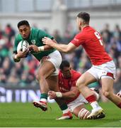 24 February 2018; Bundee Aki of Ireland is tackled by Aaron Shingler of Wales during the NatWest Six Nations Rugby Championship match between Ireland and Wales at the Aviva Stadium in Dublin. Photo by Ramsey Cardy/Sportsfile