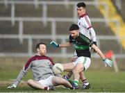 24 February 2018; Jack Horgan of Nemo Rangers has his shot on goal saved by Antoin McMullan of Slaughtneil during the AIB GAA Football All-Ireland Senior Club Championship Semi-Final match between Nemo Rangers and Slaughtneil at O'Moore Park in Portlaoise, Co Laois. Photo by Eóin Noonan/Sportsfile