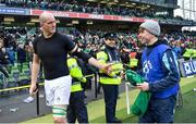 24 February 2018; Devin Toner of Ireland hands his match jersey to ballboy Colman Toner following the NatWest Six Nations Rugby Championship match between Ireland and Wales at the Aviva Stadium in Dublin. Photo by Ramsey Cardy/Sportsfile