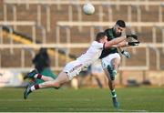 24 February 2018; Jack Horgan of Nemo Rangers has his shot blocked by Patsy Bradley of Slaughtneil during the AIB GAA Football All-Ireland Senior Club Championship Semi-Final match between Nemo Rangers and Slaughtneil at O'Moore Park in Portlaoise, Co Laois. Photo by Eóin Noonan/Sportsfile