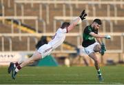 24 February 2018; Jack Horgan of Nemo Rangers has his shot blocked by Patsy Bradley of Slaughtneil during the AIB GAA Football All-Ireland Senior Club Championship Semi-Final match between Nemo Rangers and Slaughtneil at O'Moore Park in Portlaoise, Co Laois. Photo by Eóin Noonan/Sportsfile