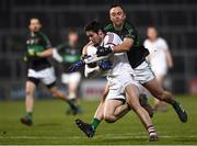 24 February 2018; Christopher McKaigue of Slaughtneil is tackled by Paul Kerrigan of Nemo Rangers during the AIB GAA Football All-Ireland Senior Club Championship Semi-Final match between Nemo Rangers and Slaughtneil at O'Moore Park in Portlaoise, Co Laois. Photo by Eóin Noonan/Sportsfile