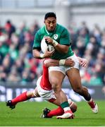 24 February 2018; Bundee Aki of Ireland is tackled by Aaron Shingler of Wales during the NatWest Six Nations Rugby Championship match between Ireland and Wales at the Aviva Stadium in Dublin. Photo by Ramsey Cardy/Sportsfile