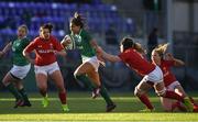 25 February 2018; Sene Naoupu of Ireland breaks the tackle of Beth Lewis of Wales in the build up to her side's second try during the Women's Six Nations Rugby Championship match between Ireland and Wales at Donnybrook Stadium in Dublin. Photo by David Fitzgerald/Sportsfile