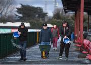27 February 2018; Club volunteers spread salt, due to the expected cold temperatures, prior to the SSE Airtricity League Premier Division match between Dundalk and Limerick at Oriel Park in Dundalk, Co Louth. Photo by Stephen McCarthy/Sportsfile