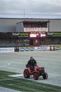 27 February 2018; A member of the Oriel Park ground staff clears snow from the pitch prior to the SSE Airtricity League Premier Division match between Dundalk and Limerick at Oriel Park in Dundalk, Co Louth. Photo by Stephen McCarthy/Sportsfile
