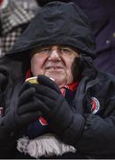 27 February 2018; A Bohemians supporter keeps warm prior to the SSE Airtricity League Premier Division match between Bohemians and Derry City at Dalymount Park in Dublin. Photo by David Fitzgerald/Sportsfile