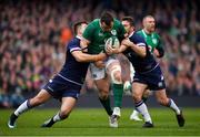 10 March 2018; Cian Healy of Ireland is tackled by Huw Jones, left, and Greig Laidlaw of Scotland during the NatWest Six Nations Rugby Championship match between Ireland and Scotland at the Aviva Stadium in Dublin. Photo by Brendan Moran/Sportsfile