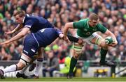 10 March 2018; Dan Leavy of Ireland is tackled by Grant Gilchrist of Scotland during the NatWest Six Nations Rugby Championship match between Ireland and Scotland at the Aviva Stadium in Dublin. Photo by Ramsey Cardy/Sportsfile