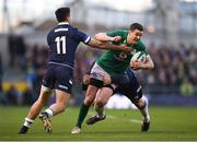 10 March 2018; Jonathan Sexton of Ireland is tackled by Sean Maitland, left, and Willem Nel of Scotland during the NatWest Six Nations Rugby Championship match between Ireland and Scotland at the Aviva Stadium in Dublin. Photo by Stephen McCarthy/Sportsfile