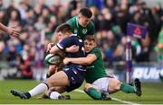10 March 2018; Huw Jones of Scotland is tackled by Jacob Stockdale, left, and Garry Ringrose of Ireland during the NatWest Six Nations Rugby Championship match between Ireland and Scotland at the Aviva Stadium in Dublin. Photo by Ramsey Cardy/Sportsfile