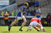 11 March 2018; Bill Maher of Tipperary in action against Darren Marks of Louth on his way to scoring his side's first goal during the Allianz Football League Division 2 Round 5 match between Tipperary and Louth at Semple Stadium in Thurles, Co Tipperary. Photo by Sam Barnes/Sportsfile