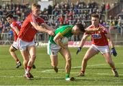 11 March 2018: Donal Lenihan of Meath in action against Sean White and Kevin Flahive of Cork during the Allianz Football League Division 2 Round 5 match between Meath and Cork at Páirc Tailteann in Navan, Co Meath. Photo by Oliver McVeigh/Sportsfile