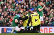 10 March 2018: Cian Healy of Ireland is treated for an injury by team doctor Dr Ciarán Cosgrave during the NatWest Six Nations Rugby Championship match between Ireland and Scotland at the Aviva Stadium in Dublin. Photo by Ramsey Cardy/Sportsfile
