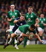 10 March 2018: Conor Murray of Ireland is tackled by John Barclay of Scotland during the NatWest Six Nations Rugby Championship match between Ireland and Scotland at the Aviva Stadium in Dublin. Photo by Ramsey Cardy/Sportsfile