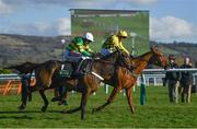 13 March 2018; Buveur D'air, left, with Barry Geraghty up, races alongside Melon, with Paul Townend up, who finished second, on their way to winning The UniBet Champion Hurdle Challenge Trophy during Day One of the Cheltenham Racing Festival at Prestbury Park in Cheltenham, England. Photo by Ramsey Cardy/Sportsfile
