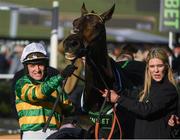 13 March 2018; Jockey Barry Geraghty, celebrates with Hannah Ryan and Buveur D'air after winning The UniBet Champion Hurdle Challenge Trophy, on Day One of the Cheltenham Racing Festival at Prestbury Park in Cheltenham, England. Photo by Ramsey Cardy/Sportsfile