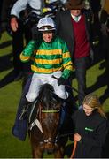 13 March 2018; Barry Geraghty acknowledges the crowd as he enters the winners' enclosure after winning the UniBet Champion Hurdle Challenge Trophy with Buveur D'Air on Day One of the Cheltenham Racing Festival at Prestbury Park in Cheltenham, England. Photo by Seb Daly/Sportsfile