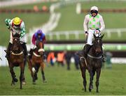 13 March 2018; Jockey Ruby Walsh, right, stands up out of the saddle, alongside Midnight Tour, with Davy Russell up, after winning the OLBG Mares’ Hurdle Race on Benie Des Dieux on Day One of the Cheltenham Racing Festival at Prestbury Park in Cheltenham, England. Photo by Seb Daly/Sportsfile