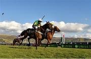 13 March 2018; Buveur D'Air, left, with Barry Geraghty up, crosses the finish post alongside Melon, right, with Paul Townend up, on their way to winning the UniBet Champion Hurdle Challenge Trophy on Day One of the Cheltenham Racing Festival at Prestbury Park in Cheltenham, England. Photo by Seb Daly/Sportsfile