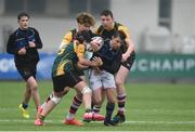 14 March 2018: Woodley Nicholson of Dundalk Grammar is tackled by Aaron Doyle, Marco Byrne and James Doyle of CBS Enniscorthy - St Marys during the Duff Cup Final match between CBS Enniscorthy - St Marys and Dundalk Grammar at Donnybrook Stadium in Dublin. Photo by Matt Browne/Sportsfile