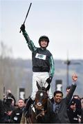 14 March 2018; Jockey Nico de Boinville celebrates as he enters the winners' enclosure after winning the Betway Queen Mother Champion Steeple Chase on Altior on Day Two of the Cheltenham Racing Festival at Prestbury Park in Cheltenham, England. Photo by Seb Daly/Sportsfile