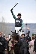 14 March 2018; Jockey Nico de Boinville celebrates as he enters the winners' enclosure after winning the Betway Queen Mother Champion Steeple Chase on Altior on Day Two of the Cheltenham Racing Festival at Prestbury Park in Cheltenham, England. Photo by Seb Daly/Sportsfile