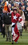 14 March 2018; Jockey Keith Donoghue celebrates as he enters the winners' enclosure after winning the Glenfarclas Steeple Chase on Tiger Roll on Day Two of the Cheltenham Racing Festival at Prestbury Park in Cheltenham, England. Photo by Seb Daly/Sportsfile
