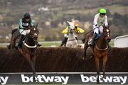 14 March 2018; Altior, left, with Nico de Boinville up, jumps the last, alongside Min, with Paul Townend up, on their way to winning the Betway Queen Mother Champion Steeple Chase on Day Two of the Cheltenham Racing Festival at Prestbury Park in Cheltenham, England. Photo by Seb Daly/Sportsfile
