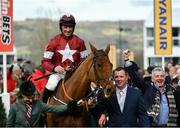 15 March 2018; Jockey Davy Russell celebrates as he enters the winners' enclosure with the groom, owner Michael O'Leary, right, and his wife Anita after winning the Ryanair Steeple Chase on Balko Des Flos on Day Three of the Cheltenham Racing Festival at Prestbury Park in Cheltenham, England. Photo by Ramsey Cardy/Sportsfile