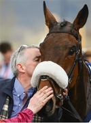 15 March 2018; Owner Michael O'Leary kisses Shattered Love after winning the JLT Novices’ Chase on Day Three of the Cheltenham Racing Festival at Prestbury Park in Cheltenham, England. Photo by Ramsey Cardy/Sportsfile