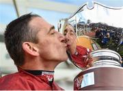 15 March 2018; Jockey Davy Russell kisses the cup after winning the Ryanair Steeple Chase with Balko Des Flos on Day Three of the Cheltenham Racing Festival at Prestbury Park in Cheltenham, England. Photo by Ramsey Cardy/Sportsfile