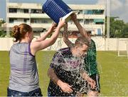 16 March 2018; Cork manager Ephie Fitzgerald is given some refreshment by Ciara Trant of Dublin, left, and Aimee Mackin of Armagh after a training session on the TG4 Ladies Football All-Star Tour 2018. Berkeley International School. Bangkok, Thailand. Photo by Piaras Ó Mídheach/Sportsfile