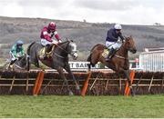 16 March 2018; Farclas, left, with Jack Kennedy up, who finished first, jumps the last ahead of eventual second place finisher Mr Adjudicator, with Paul Townend up, during the JCB Triumph Hurdle on Day Four of the Cheltenham Racing Festival at Prestbury Park in Cheltenham, England. Photo by Seb Daly/Sportsfile