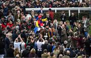16 March 2018; Jockey Richard Johnson celebrates as he enters the winners' enclosure after winning the Timico Cheltenham Gold Cup Steeple Chase on Native River on Day Four of the Cheltenham Racing Festival at Prestbury Park in Cheltenham, England. Photo by Ramsey Cardy/Sportsfile