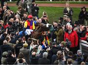 16 March 2018; Jockey Richard Johnson celebrates as he enters the winners' enclosure after winning the Timico Cheltenham Gold Cup Steeple Chase on Native River on Day Four of the Cheltenham Racing Festival at Prestbury Park in Cheltenham, England. Photo by Ramsey Cardy/Sportsfile