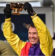 16 March 2018; Jockey Richard Johnson lifts the Gold Cup after winning the Timico Cheltenham Gold Cup Steeple Chase on Native River on Day Four of the Cheltenham Racing Festival at Prestbury Park in Cheltenham, England. Photo by Seb Daly/Sportsfile