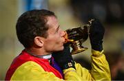 16 March 2018; Jockey Richard Johnson celebrates with the Gold Cup after winning the Timico Cheltenham Gold Cup Steeple Chase on Native River on Day Four of the Cheltenham Racing Festival at Prestbury Park in Cheltenham, England. Photo by Ramsey Cardy/Sportsfile