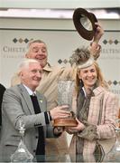 16 March 2018; Owners Michael O'Leary, behind, and wife Anita are presented with the winning trophy by former trainer Martin Pipe are sending out Blow By Blow to win the Martin Pipe Conditional Jockeys’ Handicap Hurdle Race on Day Four of the Cheltenham Racing Festival at Prestbury Park in Cheltenham, England. Photo by Seb Daly/Sportsfile