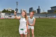 17 March 2018; Sarah Rowe of Mayo, left, and Aishling Moloney of Tipperary take a selfie before the 2016 All-Stars v 2017 All-Stars Exhibition match during the TG4 Ladies Football All-Star Tour 2018. Chulalongkorn University Football Club Stadium, Bangkok, Thailand. Photo by Piaras Ó Mídheach/Sportsfile